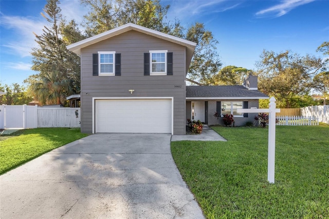 view of front property with a garage and a front lawn