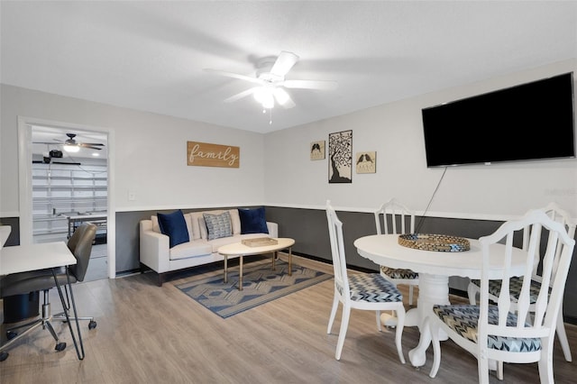 living room with hardwood / wood-style floors and ceiling fan