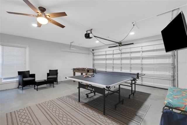 game room featuring ceiling fan and concrete flooring