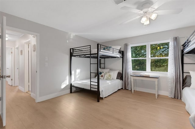 unfurnished bedroom featuring light wood-type flooring and ceiling fan