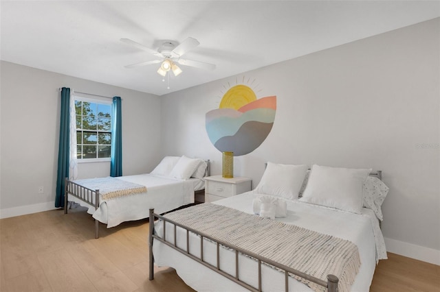 bedroom featuring ceiling fan and light hardwood / wood-style flooring