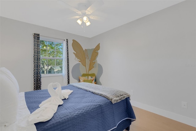 bedroom featuring ceiling fan and hardwood / wood-style floors