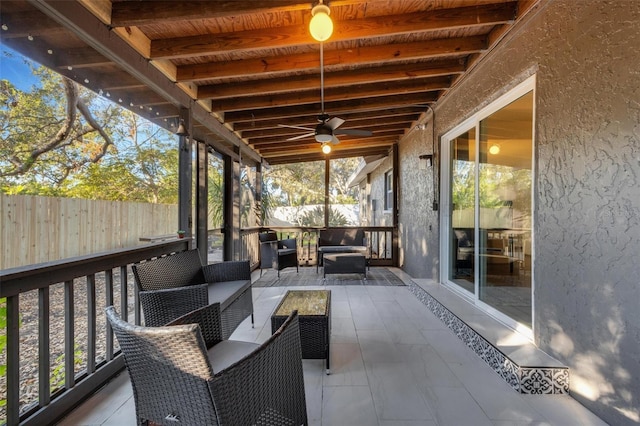 deck featuring an outdoor living space and ceiling fan