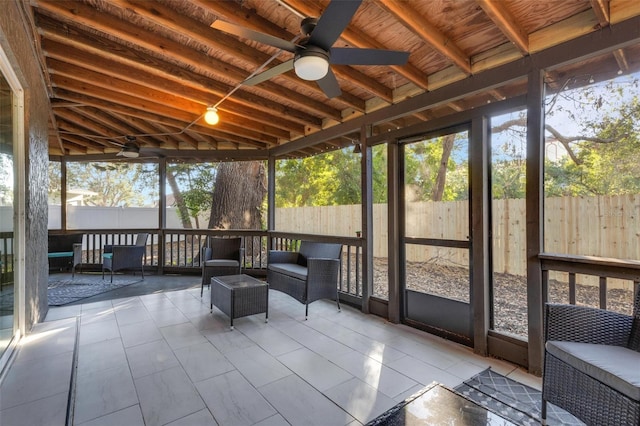 unfurnished sunroom with lofted ceiling with beams and wooden ceiling