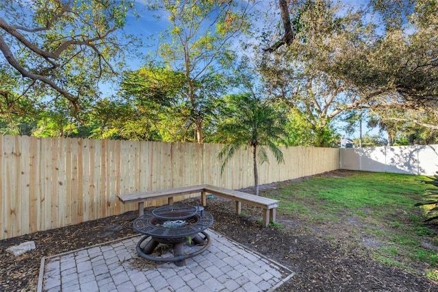 view of yard with a fire pit