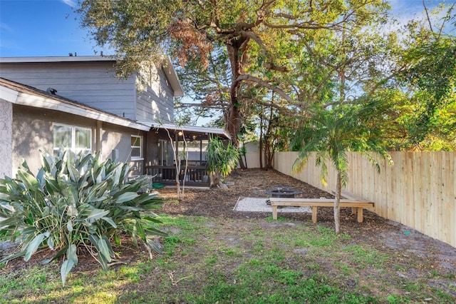 view of yard featuring a sunroom