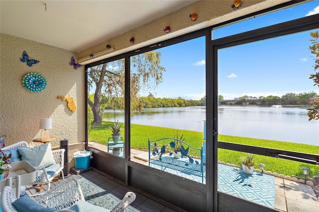 sunroom with a water view