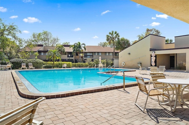 view of pool featuring a patio area