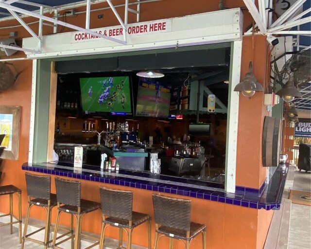 bar featuring tile counters