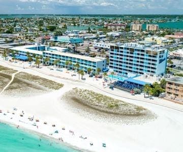 drone / aerial view featuring a water view and a beach view