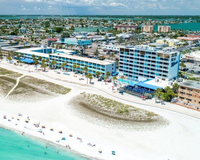 bird's eye view featuring a view of the beach and a water view