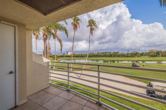 balcony featuring a water view and visible vents