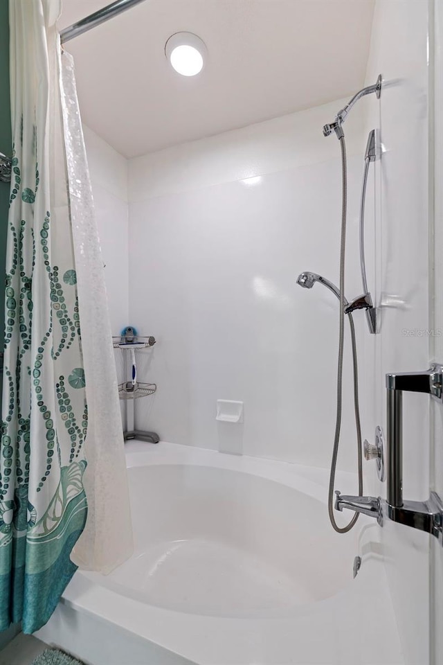 bathroom with shower / bath combo