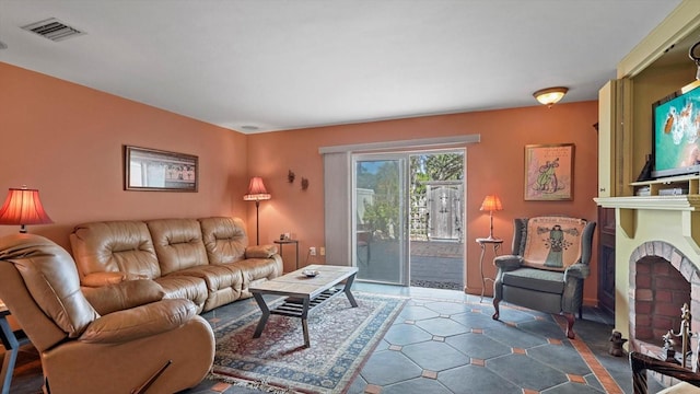 living room featuring a fireplace and visible vents