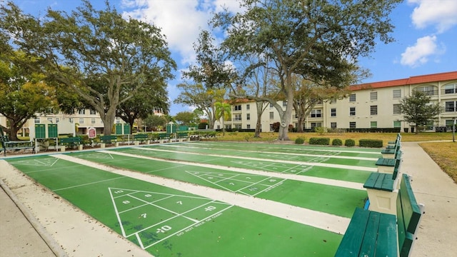 view of property's community with shuffleboard