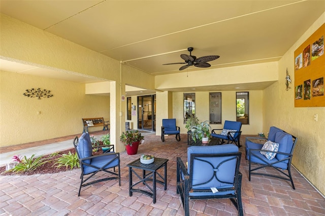 view of patio / terrace featuring ceiling fan and an outdoor living space