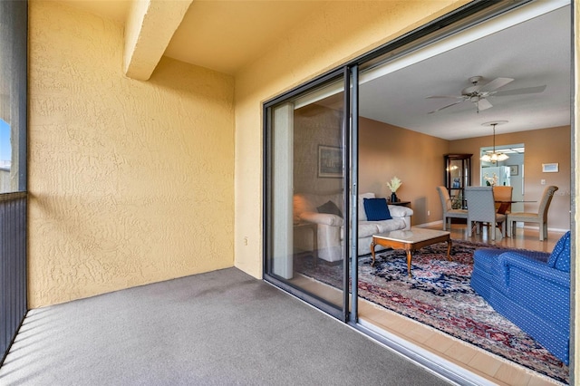 balcony featuring a ceiling fan and a patio