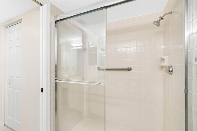 bathroom with a stall shower