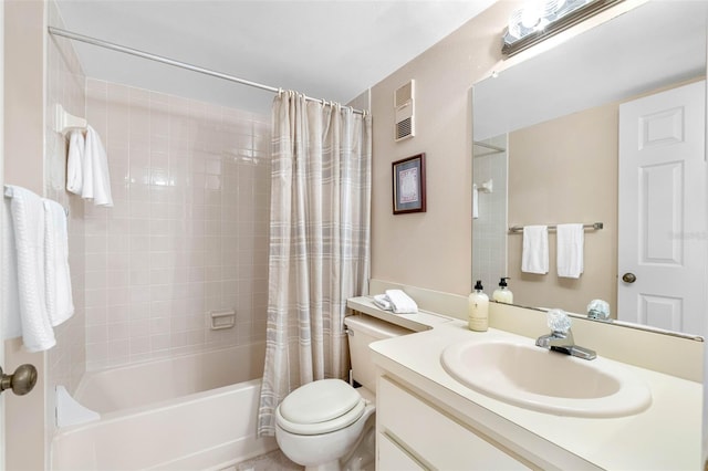 bathroom with visible vents, vanity, toilet, and shower / tub combo with curtain