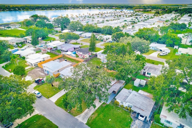 bird's eye view with a water view and a residential view