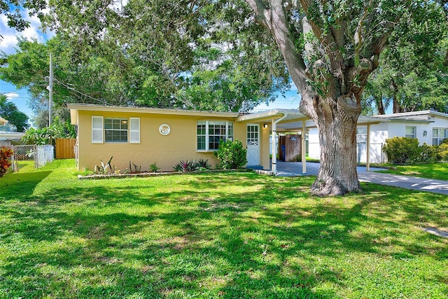 single story home with a front lawn