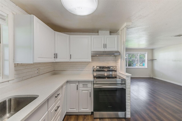 kitchen featuring electric stove, dark wood-style flooring, white cabinets, and under cabinet range hood