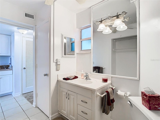 bathroom featuring tile patterned floors and vanity