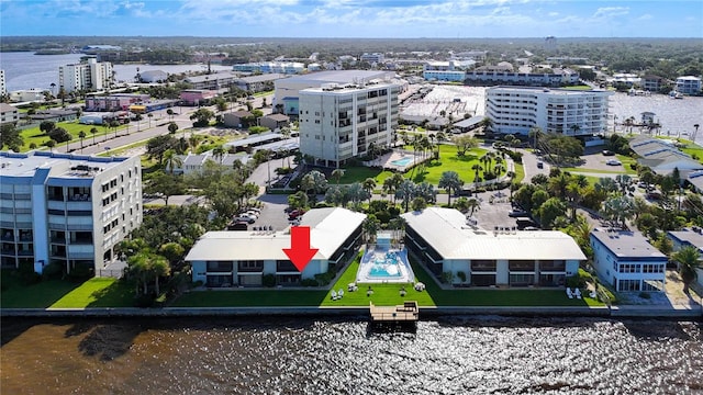 birds eye view of property with a water view