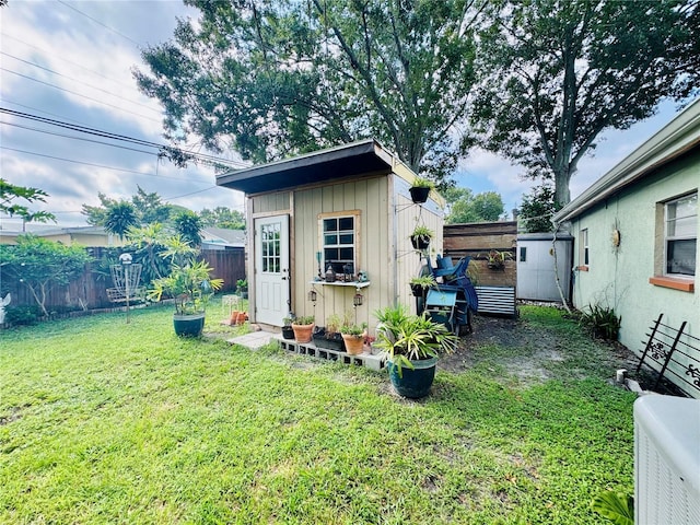 view of shed featuring a fenced backyard