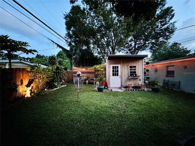 rear view of house with a lawn