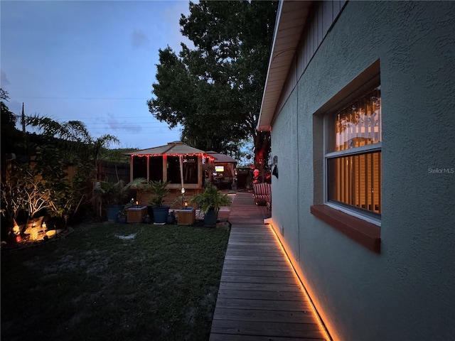 view of yard with a deck and a gazebo