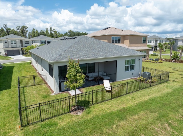 back of property with central air condition unit, a yard, and a garage