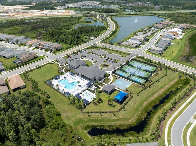 birds eye view of property with a water view