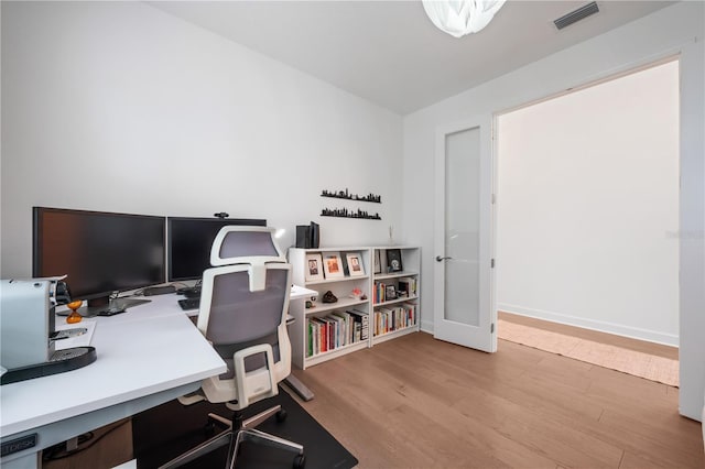 home office with light wood-type flooring