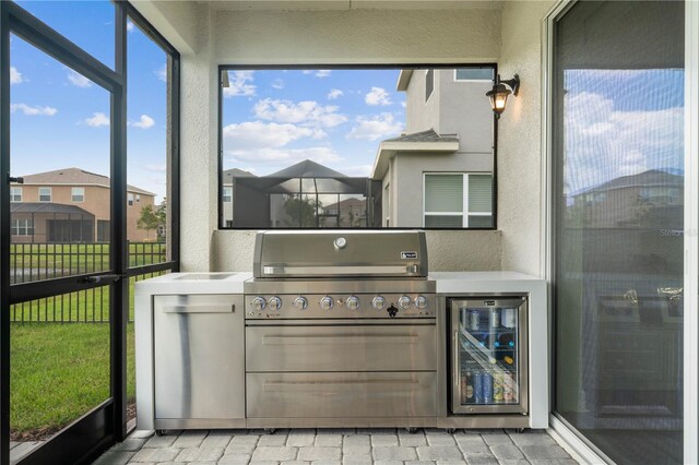 sunroom / solarium featuring wine cooler