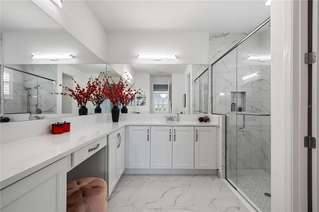 bathroom featuring vanity and a shower with door