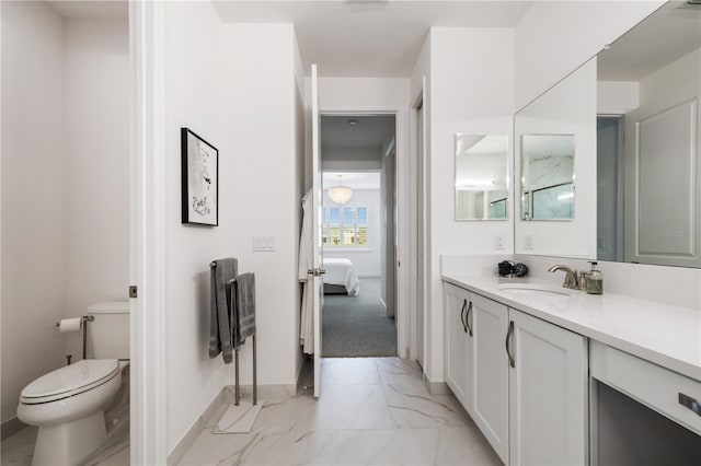 bathroom with tile patterned floors, vanity, and toilet