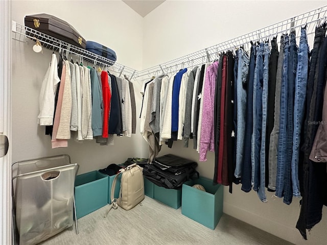 spacious closet with carpet floors