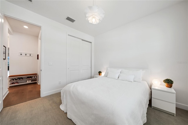 bedroom with carpet floors and a closet