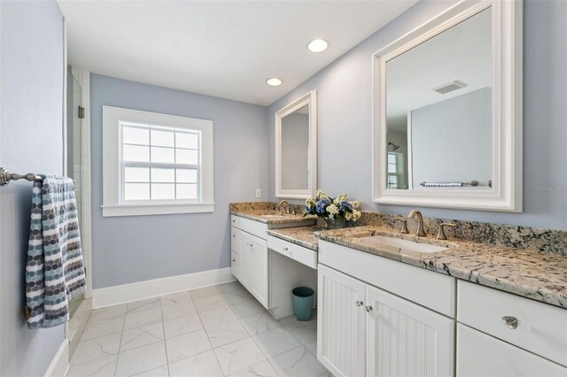 106 19th Ave, St Pete Beach, FL 33706 - bathroom featuring marble look tile flooring, double vanity, recessed lighting, and a shower