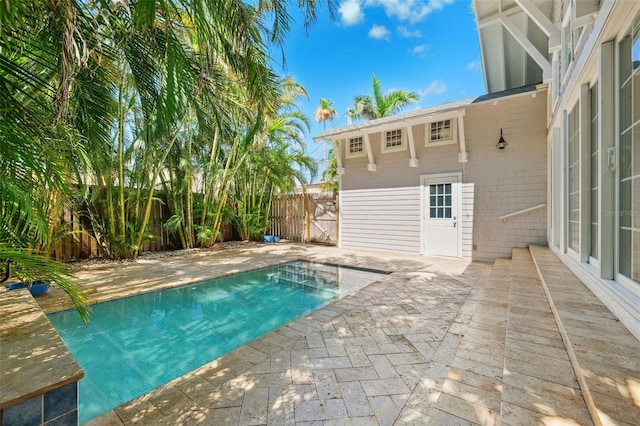 106 19th Ave, St Pete Beach, FL 33706 - view of swimming pool with a patio area and a fenced backyard