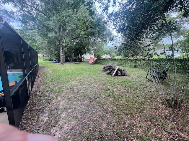 view of yard with a lanai