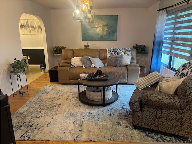 living room with a chandelier and hardwood / wood-style floors