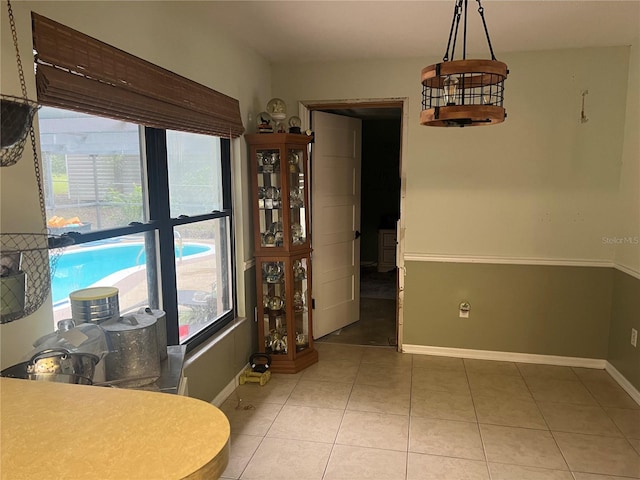 kitchen with pendant lighting, plenty of natural light, and tile patterned floors