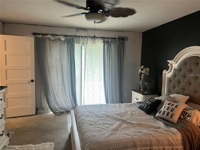 bedroom with concrete flooring, ceiling fan, and a textured ceiling