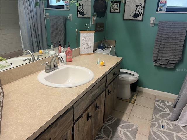 bathroom featuring walk in shower, vanity, toilet, and tile patterned floors