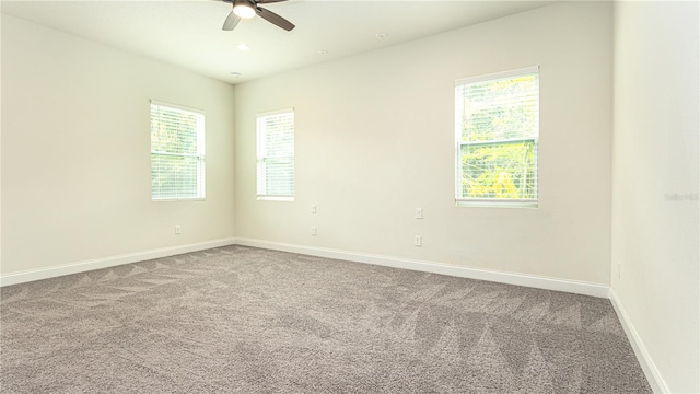 carpeted empty room with ceiling fan