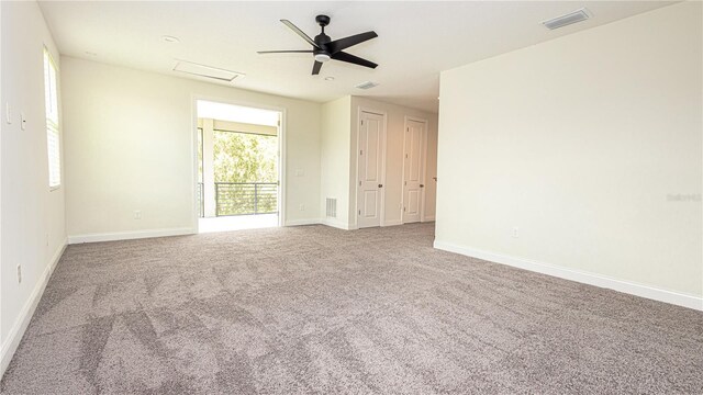 carpeted empty room with ceiling fan