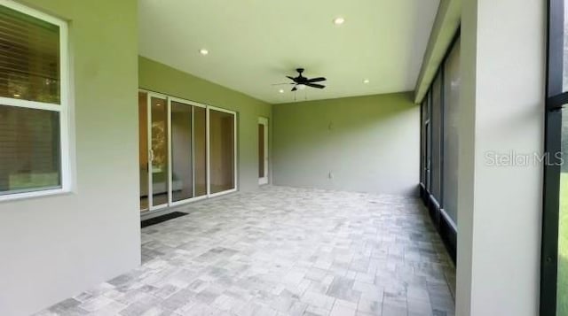 view of patio featuring ceiling fan