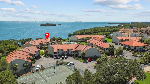 birds eye view of property with a water view and a residential view